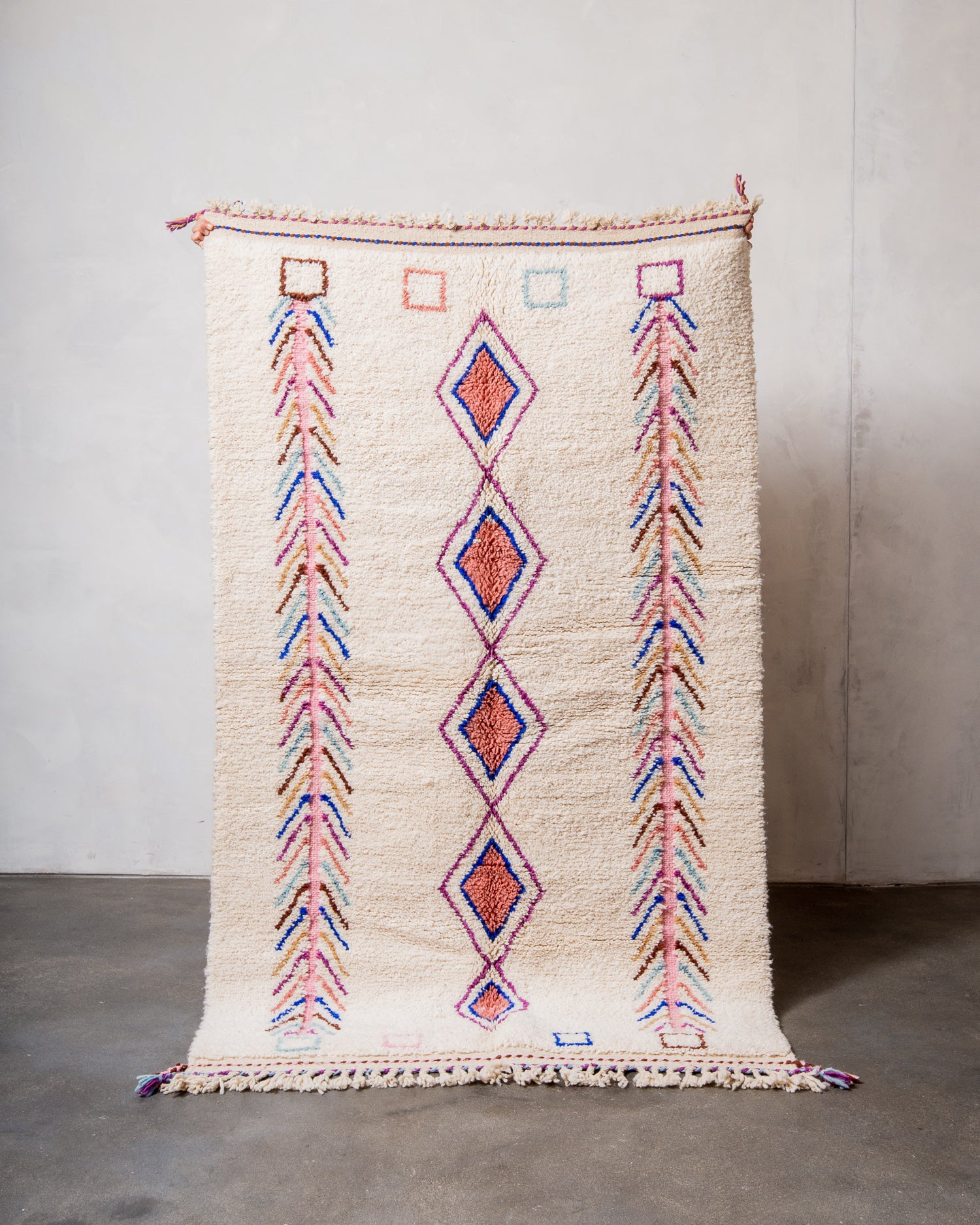 Modern, designer, handcrafted Berber rug from Morocco. Beniourain carpet with beautiful colours and patterns and fluffy wool texture.